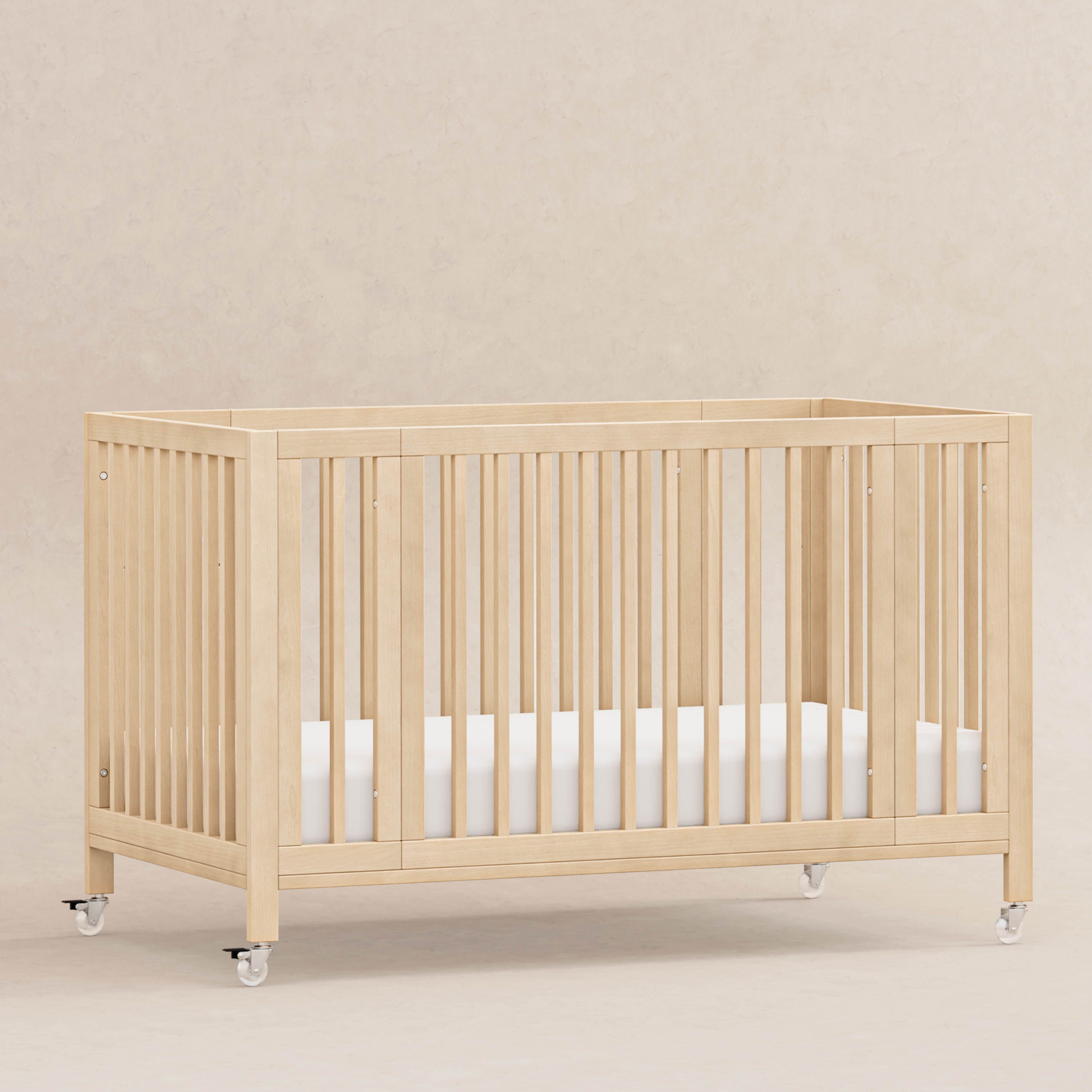 babyletto Rolli 9-in-1 Convertible All-Stages Crib with Bassinet & Toddler Bed Conversion Kits - Blonde.