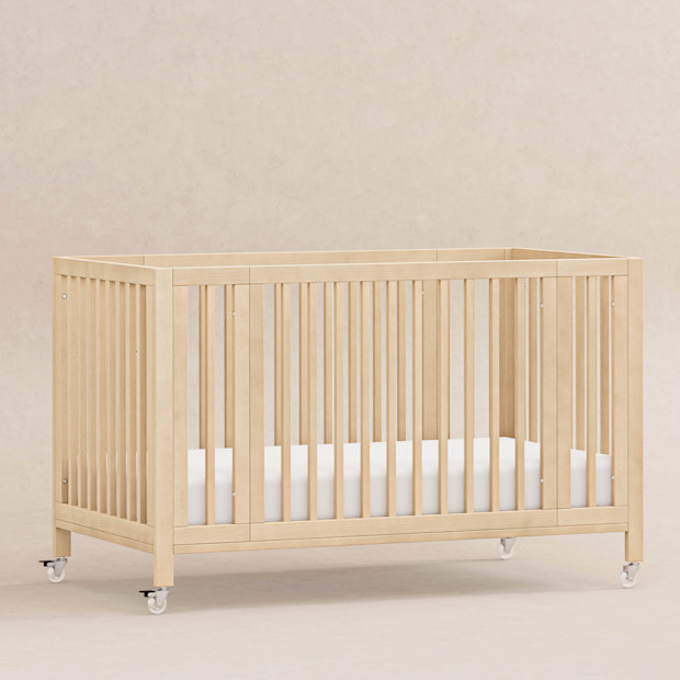 babyletto Rolli 9-in-1 Convertible All-Stages Crib with Bassinet & Toddler Bed Conversion Kits.
