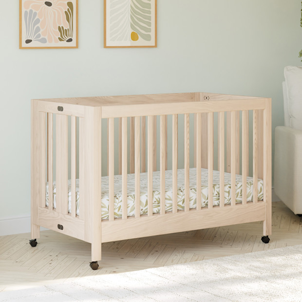babyletto Maki Portable Folding Crib with Toddler Bed Conversion Kit.