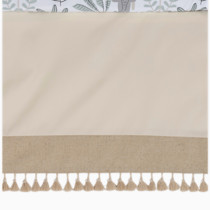Flat lay of beige crib blanket with fringe detail
