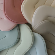 Overlapping pastel-colored infant loungers.