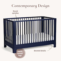 Contemporary design crib with round spindles and beveled details labeled