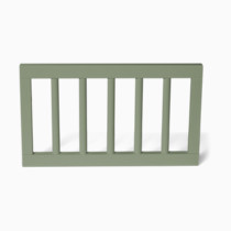 Close-up of olive green spindle guardrail with vertical slats