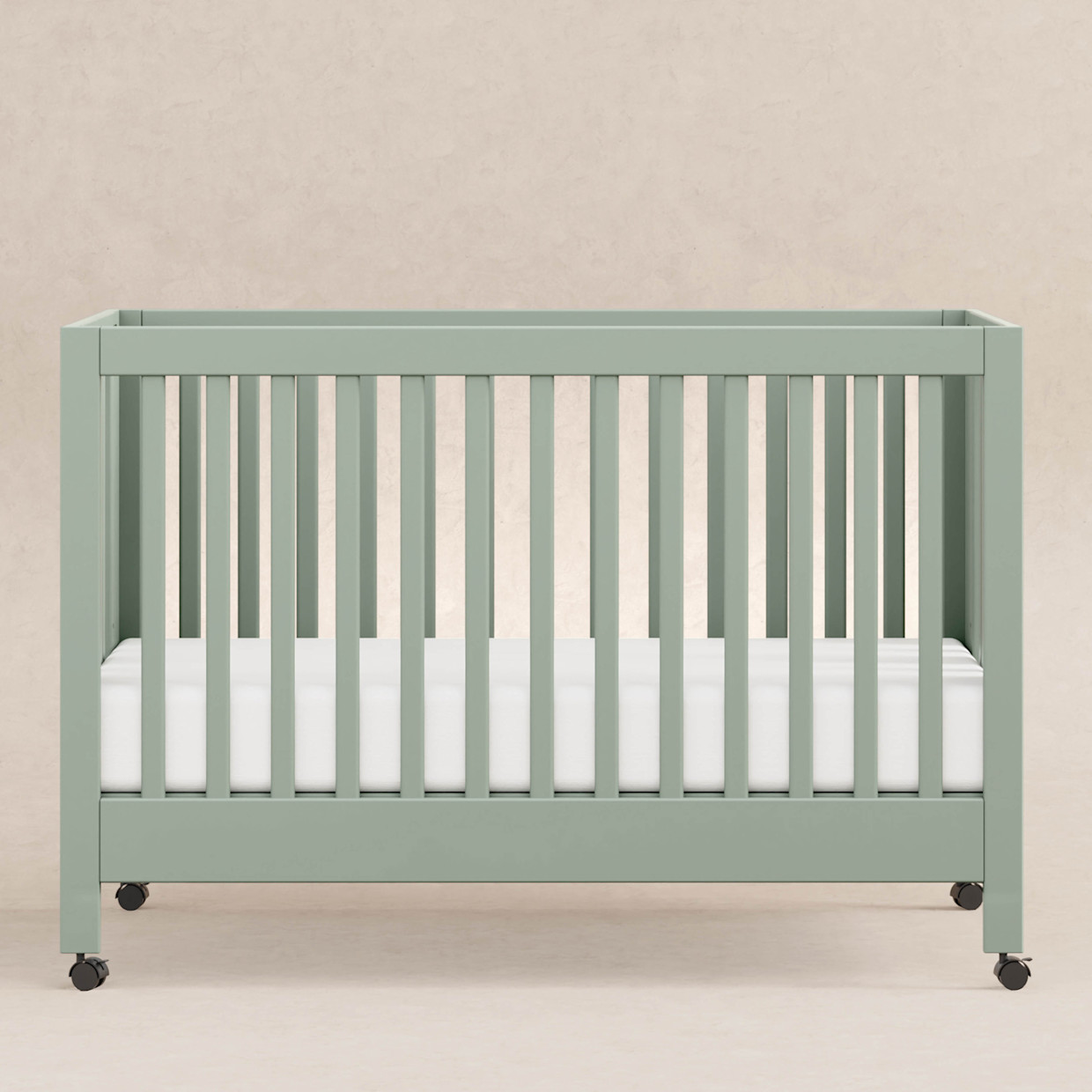 babyletto Maki Portable Folding Crib with Toddler Bed Conversion Kit - Light Sage.