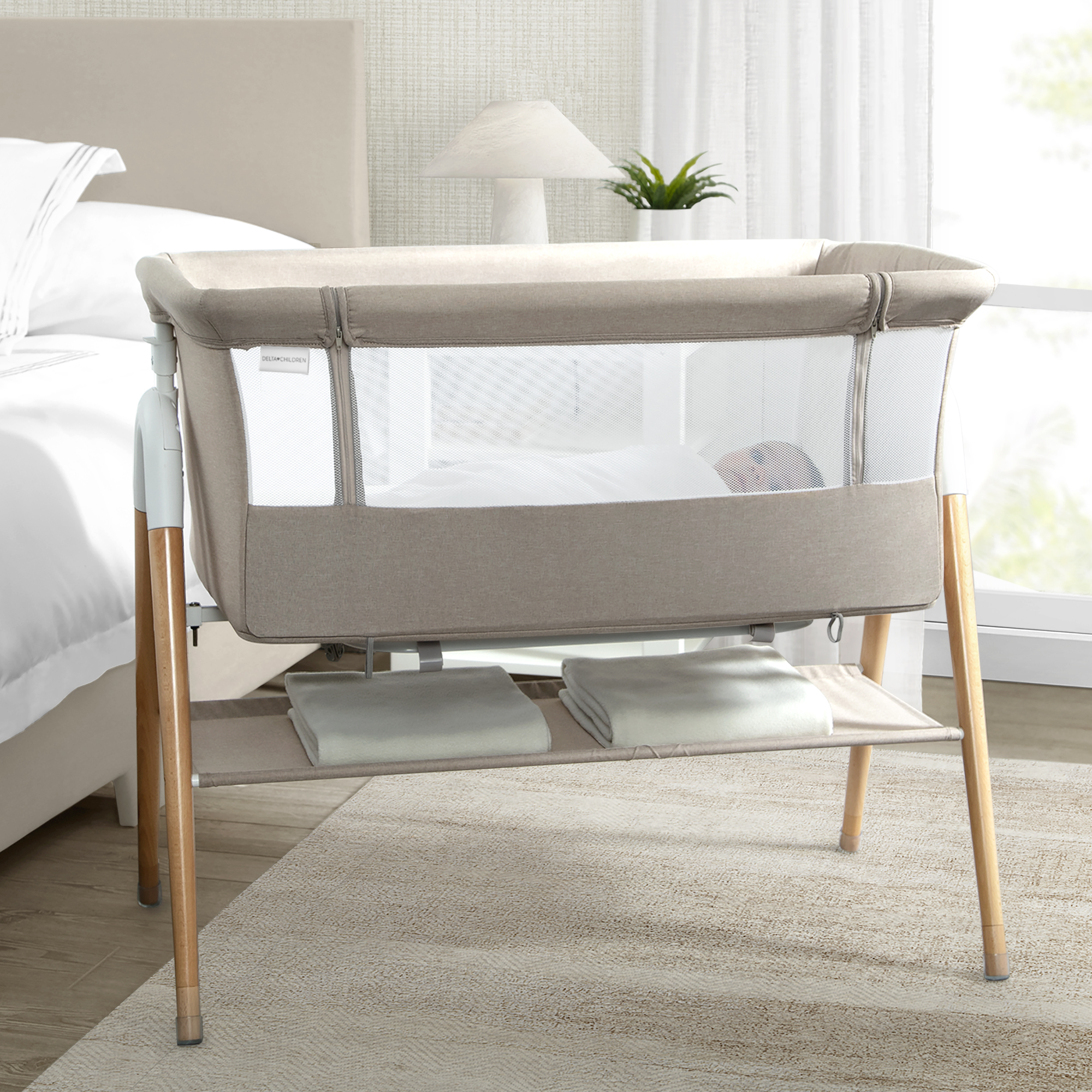 Delta Children Bondi Adjustable Height Bedside Beechwood Bassinet - Tan Melange.