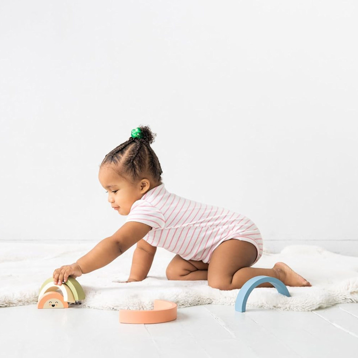 Pearhead Wooden Rainbow Stacking Toy.