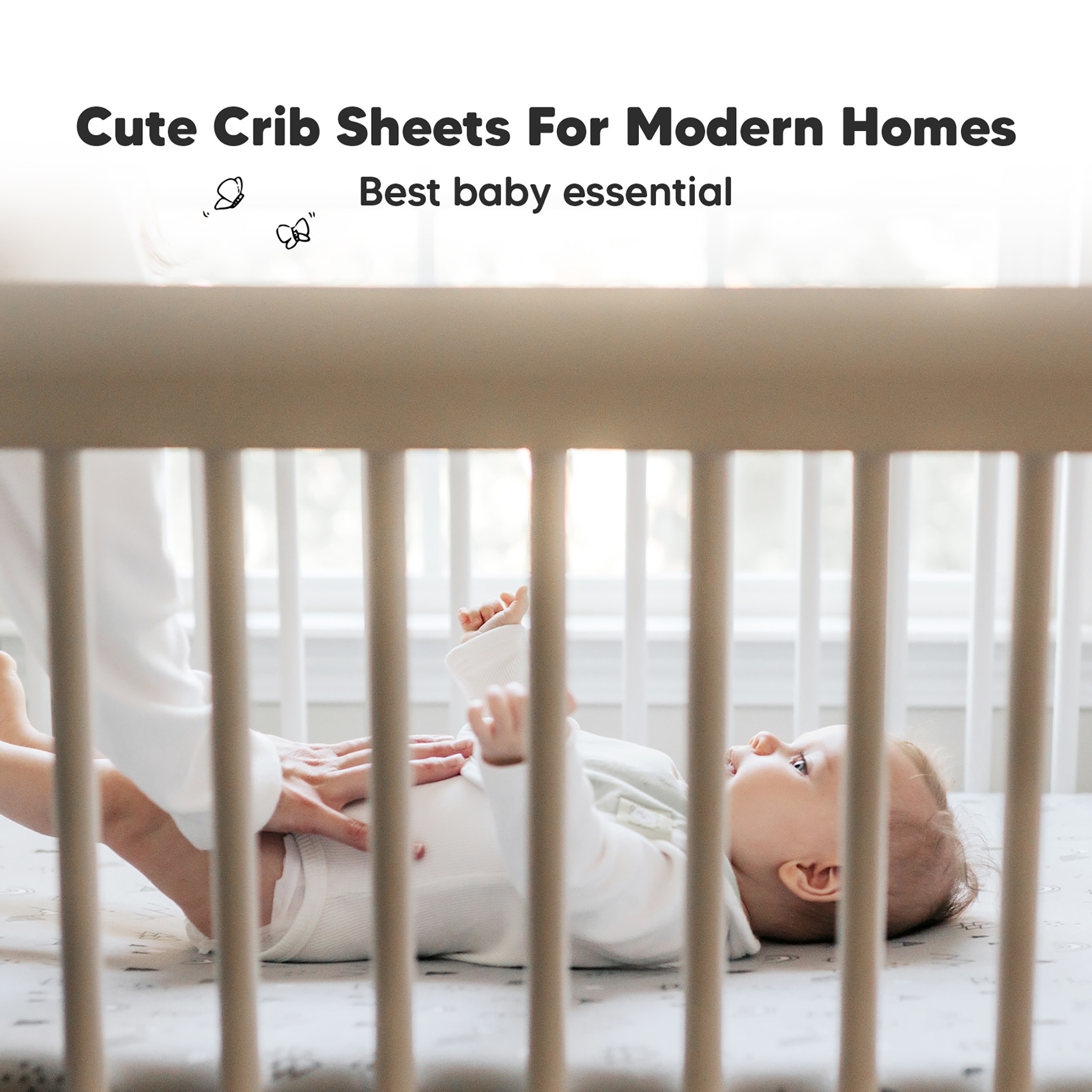 Cute white crib sheets with line art pattern near a crib rail.