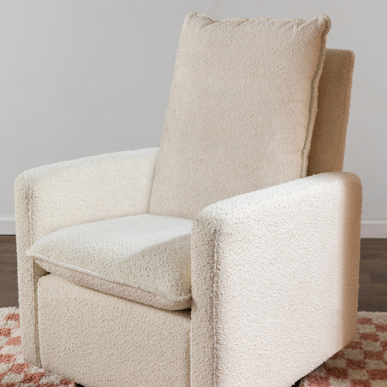 babyletto Cali Pillowback Swivel Glider - Ivory Boucle With Gold Base.