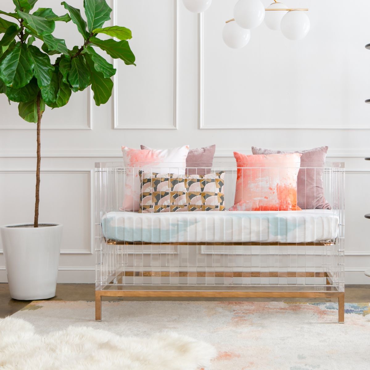 Nursery Works Luma Crib - Acrylic With Rose Gold.