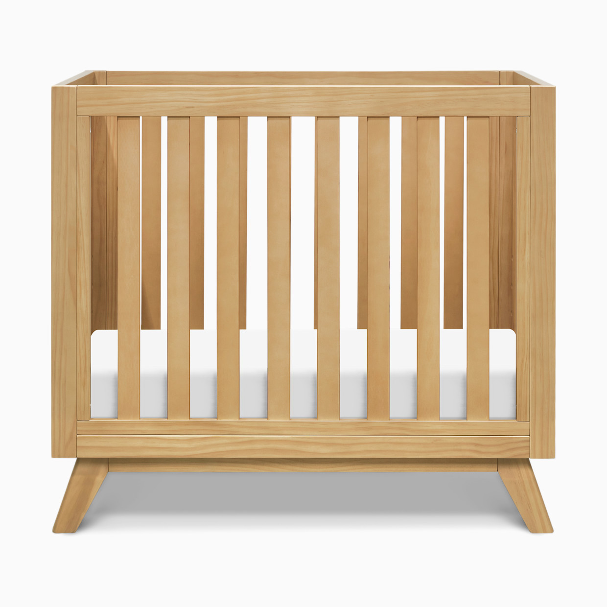daVinci Otto 3-in-1 Convertible Mini Crib with 4" Mattress - Honey.
