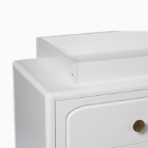 Close-up of changing topper on dresser