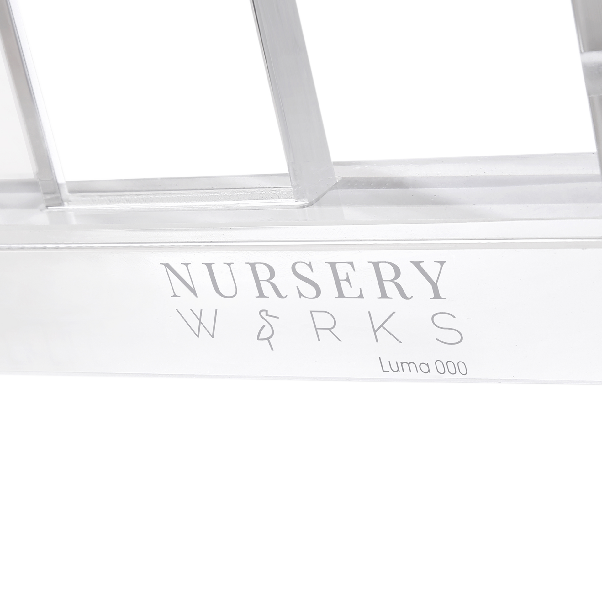 Nursery Works Luma Crib - Acrylic With Rose Gold.