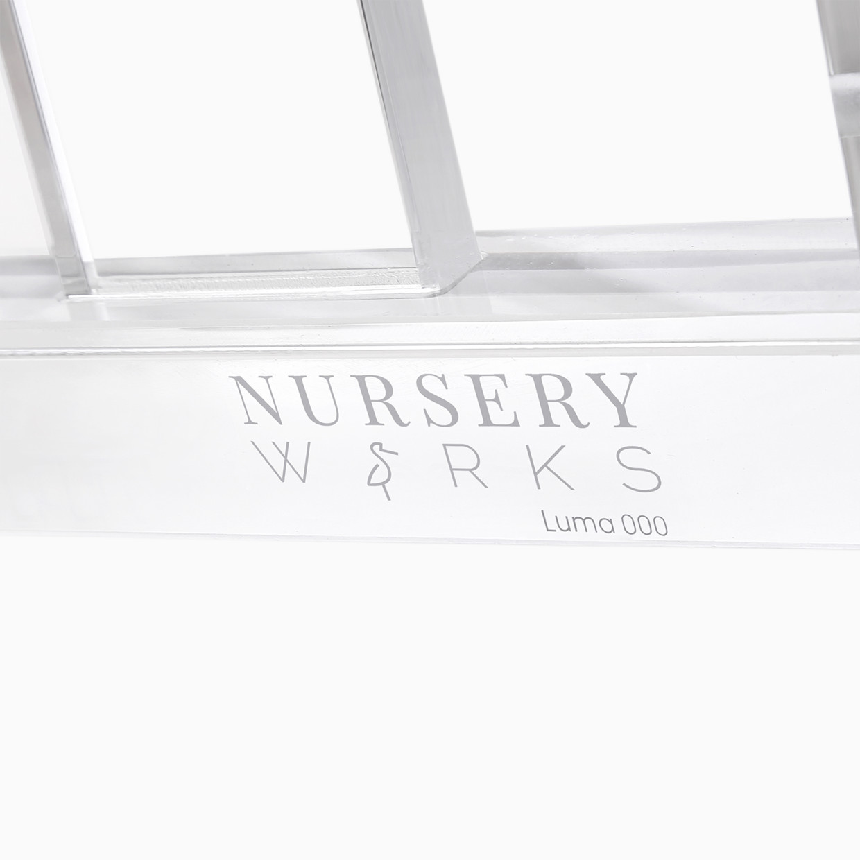 Nursery Works Luma Crib - Acrylic With Rose Gold.