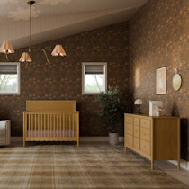 Crib in a large nursery with dresser