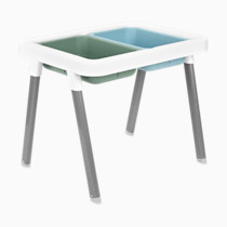 Table with white frame, grey legs, and two colored divided inserts in blue and green