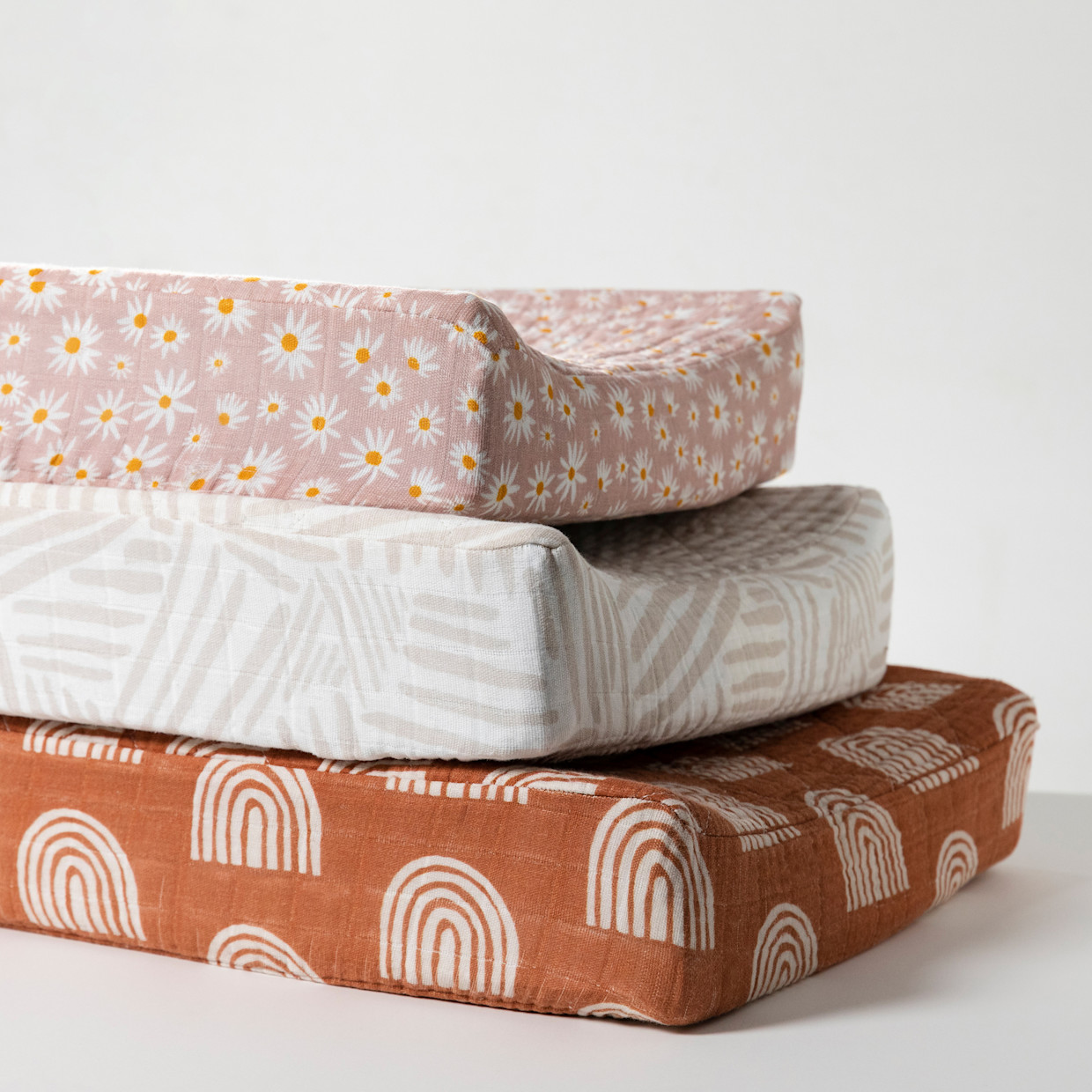 babyletto Quilted Changing Pad Cover in GOTS Certified Organic Muslin Cotton - Terracotta Rainbow.