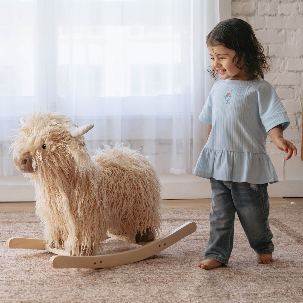 Wonder & Wise Highland Cow Rocker.