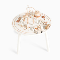 Wooden activity table with various wooden toys.