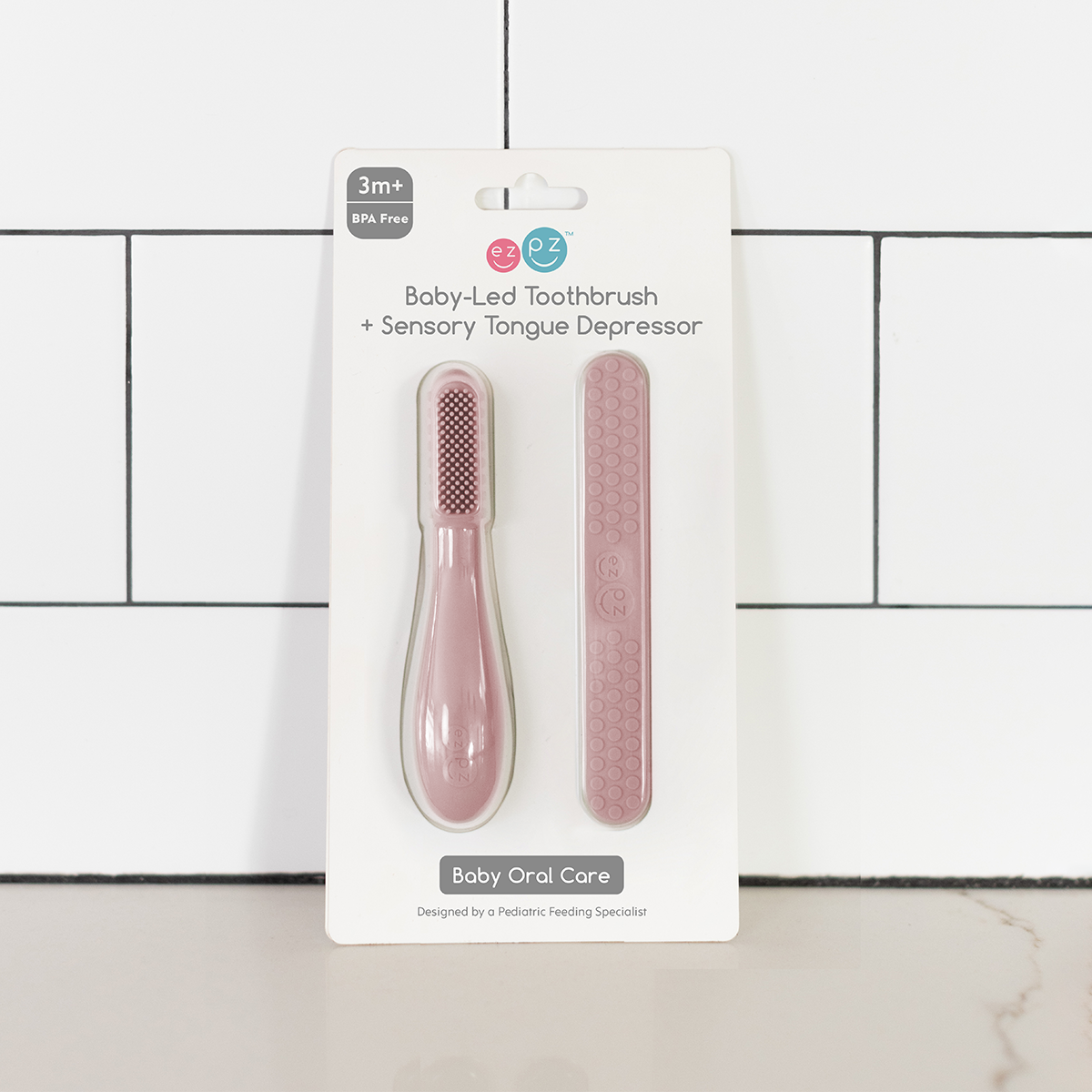 ezpz Baby-Led Toothbrush + Sensory Tongue Depressor Dual Pack - Blush.