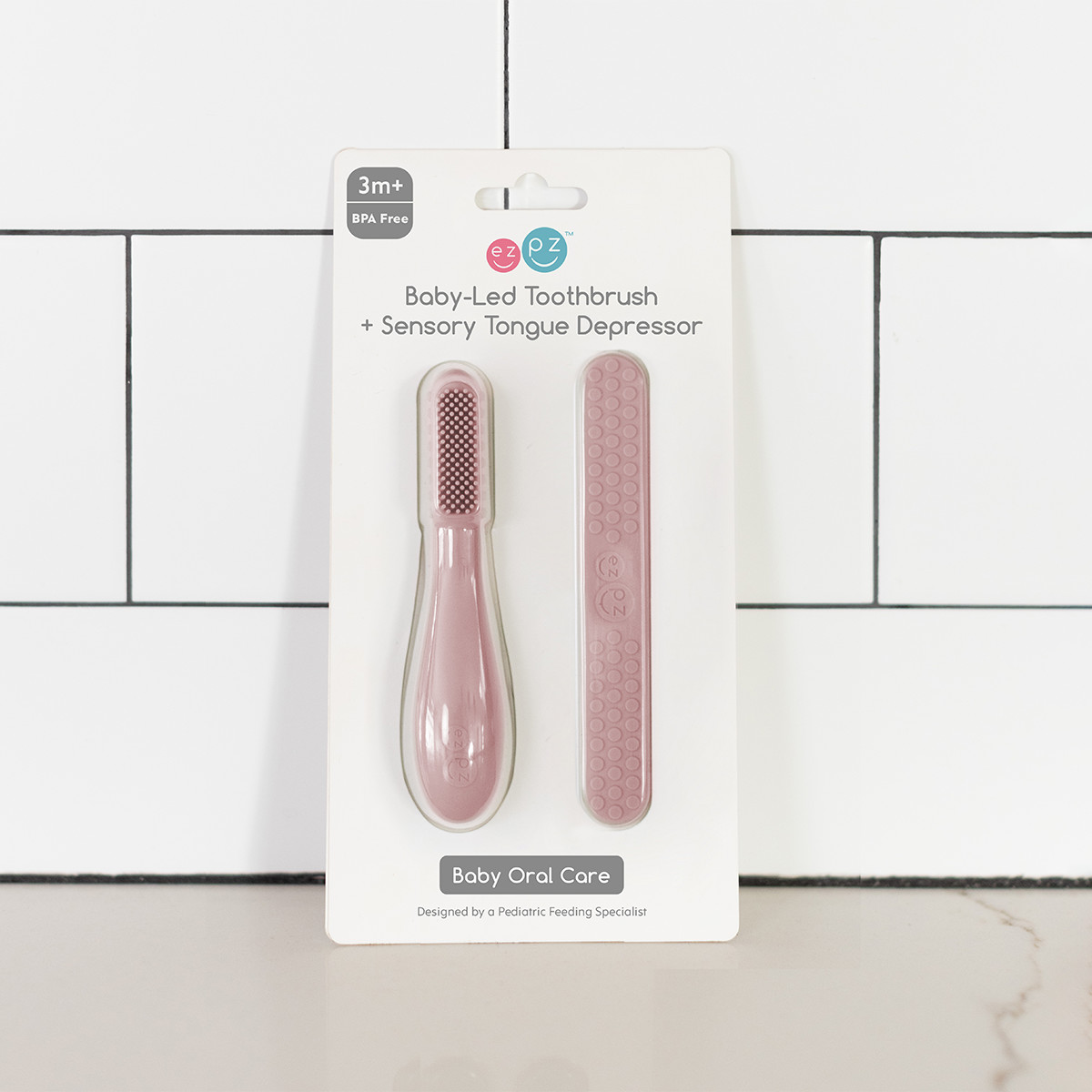 ezpz Baby-Led Toothbrush + Sensory Tongue Depressor Dual Pack - Blush.