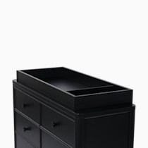 Black changing topper with tray on top of dresser