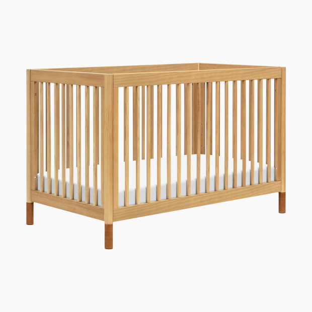babyletto Gelato 4-in-1 Convertible Crib with Toddler Bed Conversion Kit - Honey With Vegan Tan Leather Feet.