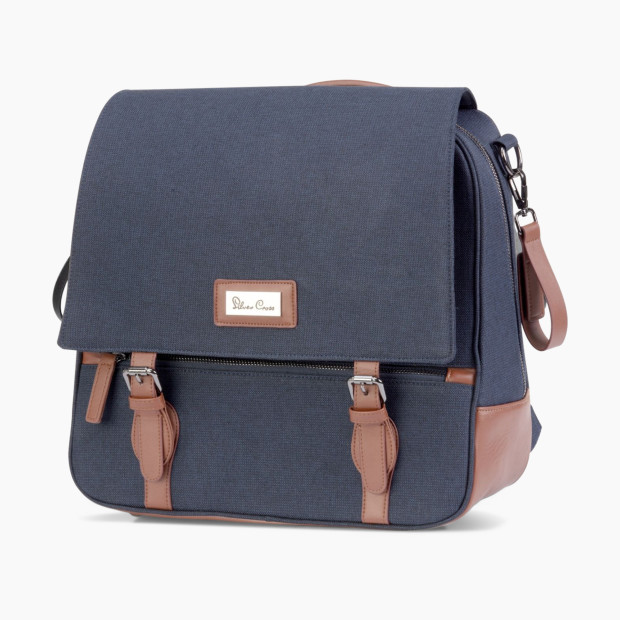 Crafted from premium fabrics, this luxurious backpack-style diaper bag features leatherette details, a magnetic fastening and adjustable shoulder straps.