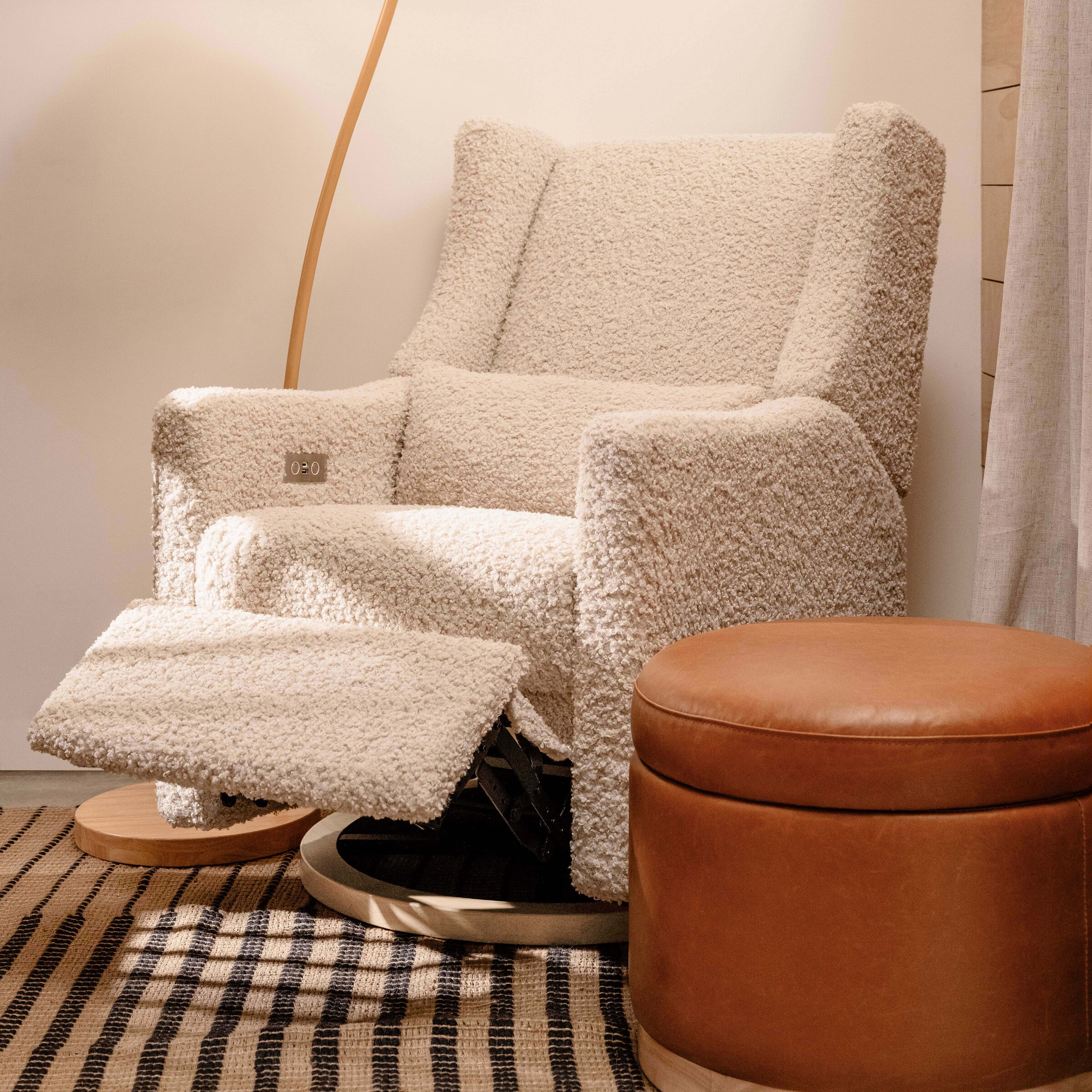 babyletto Kiwi Electronic Recliner and Swivel Glider - Almond Teddy Loop With Light Wood Base.