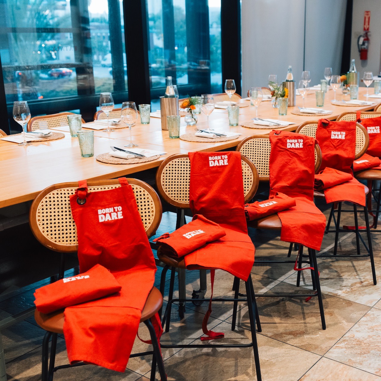 TUDOR at Eataly banquet table with branded aprons