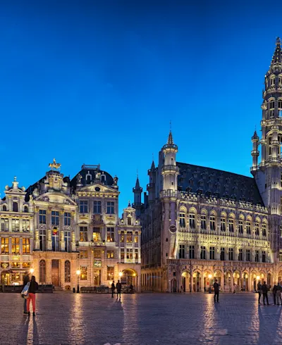 The Grand-Place in Brussels lit up and almost deserted at nightfall.