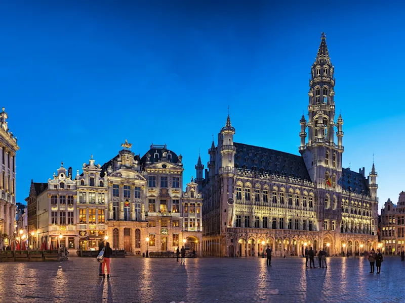The Grand-Place in Brussels lit up and almost deserted at nightfall.