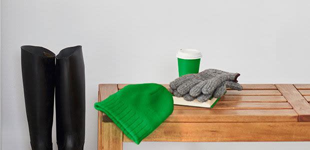 Cashmere Hat And Gloves On A Wooden Table