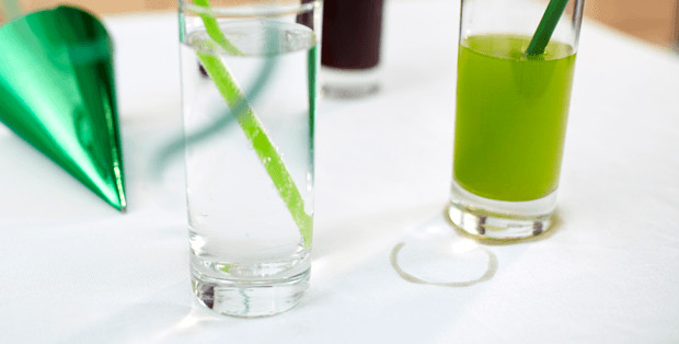 Green Soft Drink Stain On White Table Cloth