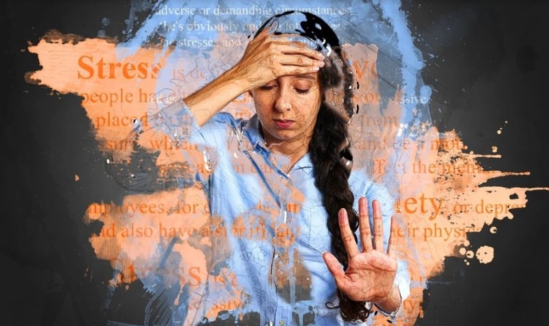 Picture of a woman feeling stressed. 