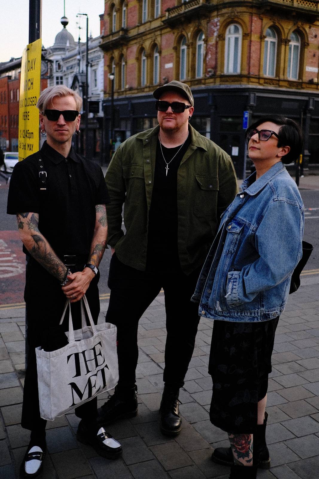 Three aging emos post grandiose yet humbly against the urban backdrop of Leeds, looking either wistfully off into the distance or straight into the camera, they embody everything that can be right with the world. Hope, confidence, quietness, serenity, camaraderie. The day was good, and so are these people. 