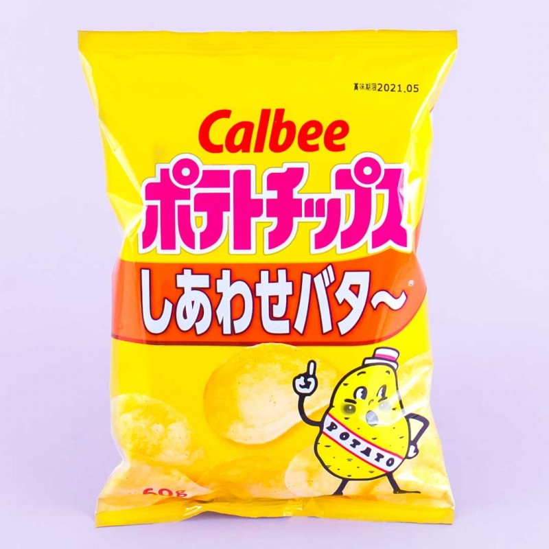 A yellow bag of potato chips in the "happy butter" flavor. There is an illustration of a potato with its finger pointing skywards on the bag.