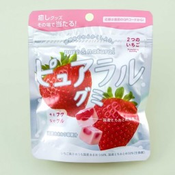 A sealed bag of gummies with two big beautiful strawberries on the front