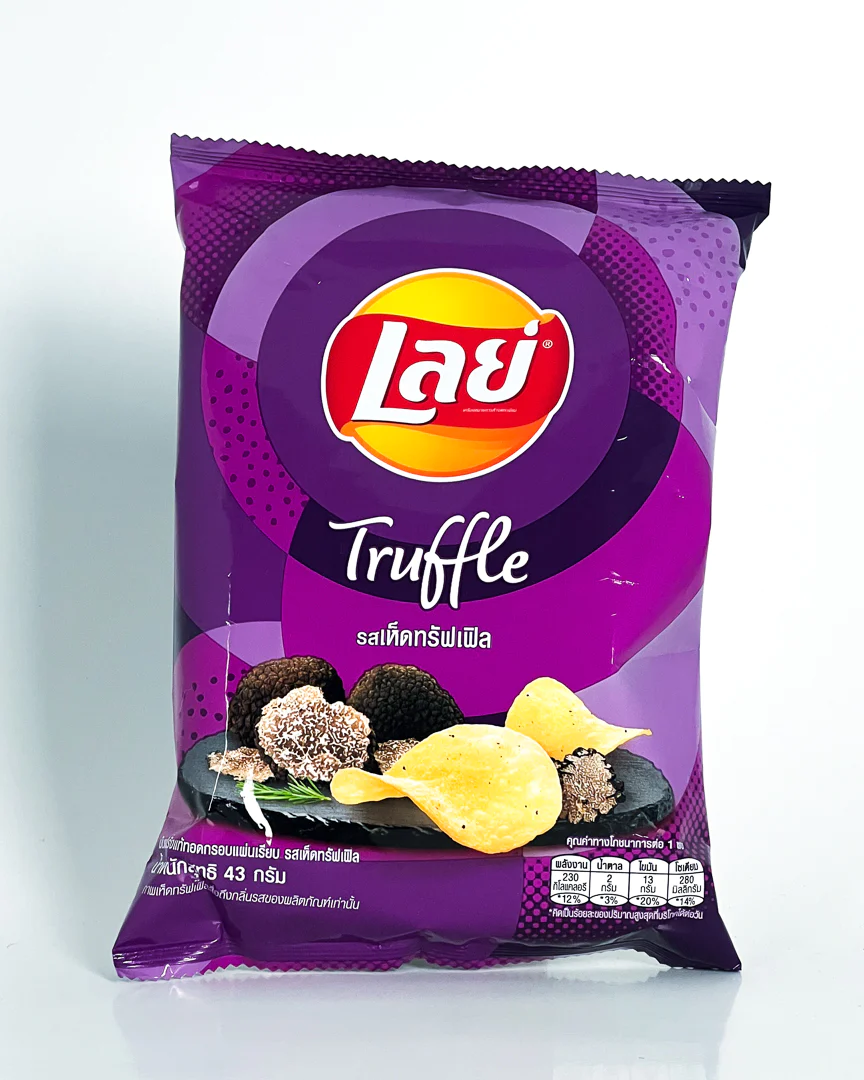 A purple bag of Lay’s chips where most of the writing is in Thai. In English it says truffle. There is an illustration of truffle mushrooms and potato chips.