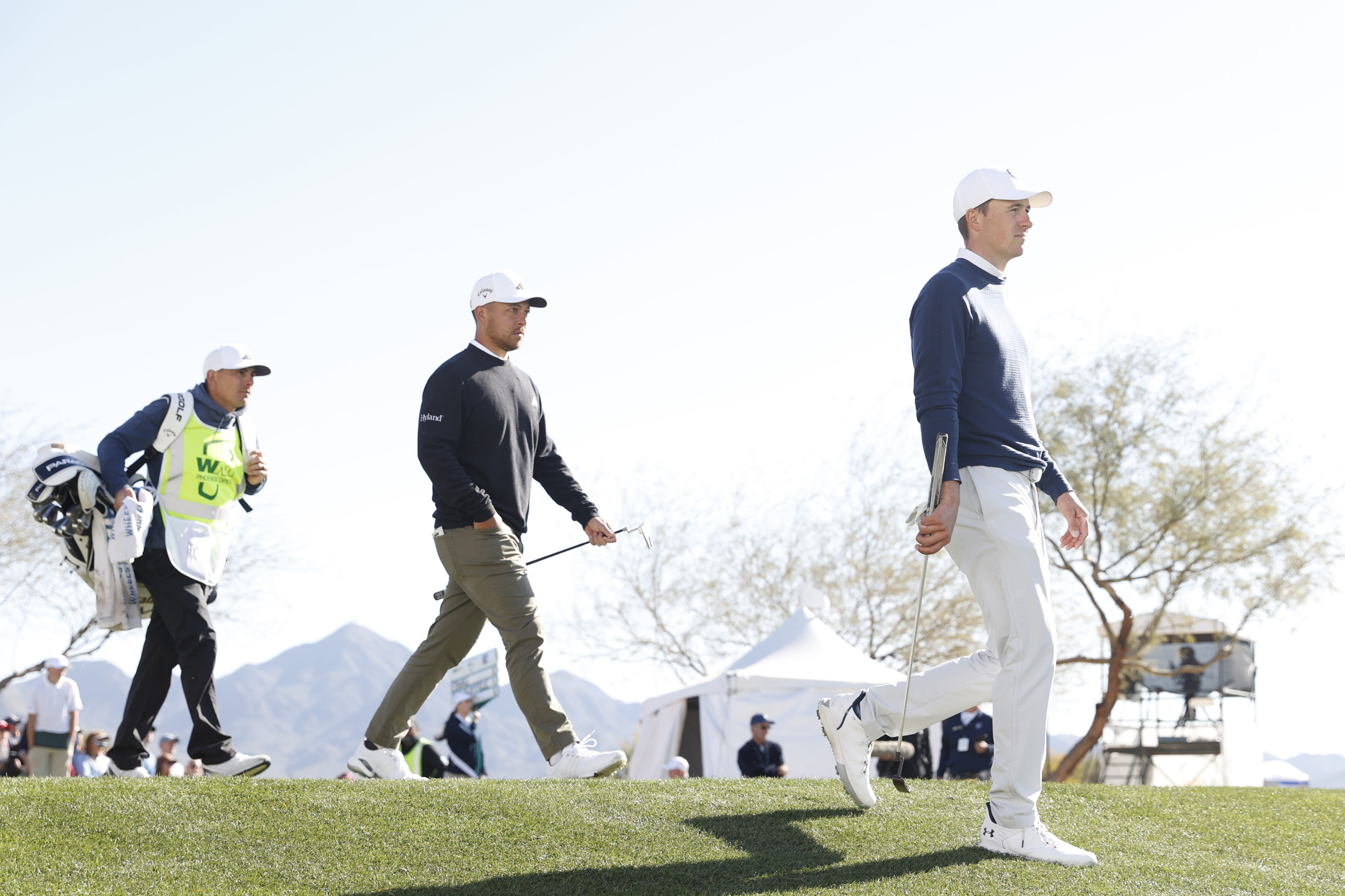 Jordan Spieth (right) and Xander Schauffele walk off the 12th tee during the first round of the 2023 WM Phoenix Open at TPC Scottsdale. (Photo by Sarah Stier/Getty Images)