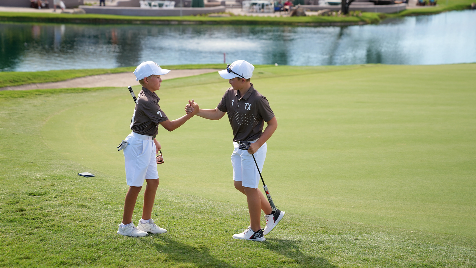 Lincoln Rubis and Brayden Verret of Team Texas celebrate during the first round of the 2022 National Car Rental PGA Jr. League Championship at Grayhawk Golf Club on October 7, 2022 in Scottsdale, Arizona. (Photo by Darren Carroll/PGA of America)