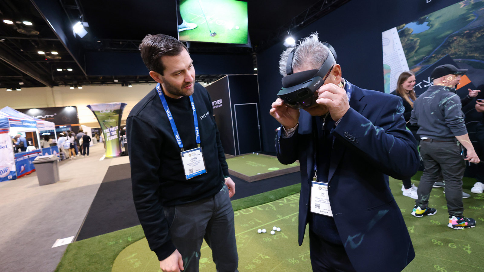 Attendees test Puttview technology during the 2023 PGA Show at Orange County Convention Center on Friday, January 27, 2023 in Orlando, Florida. (Photo by Scott Halleran/PGA of America)