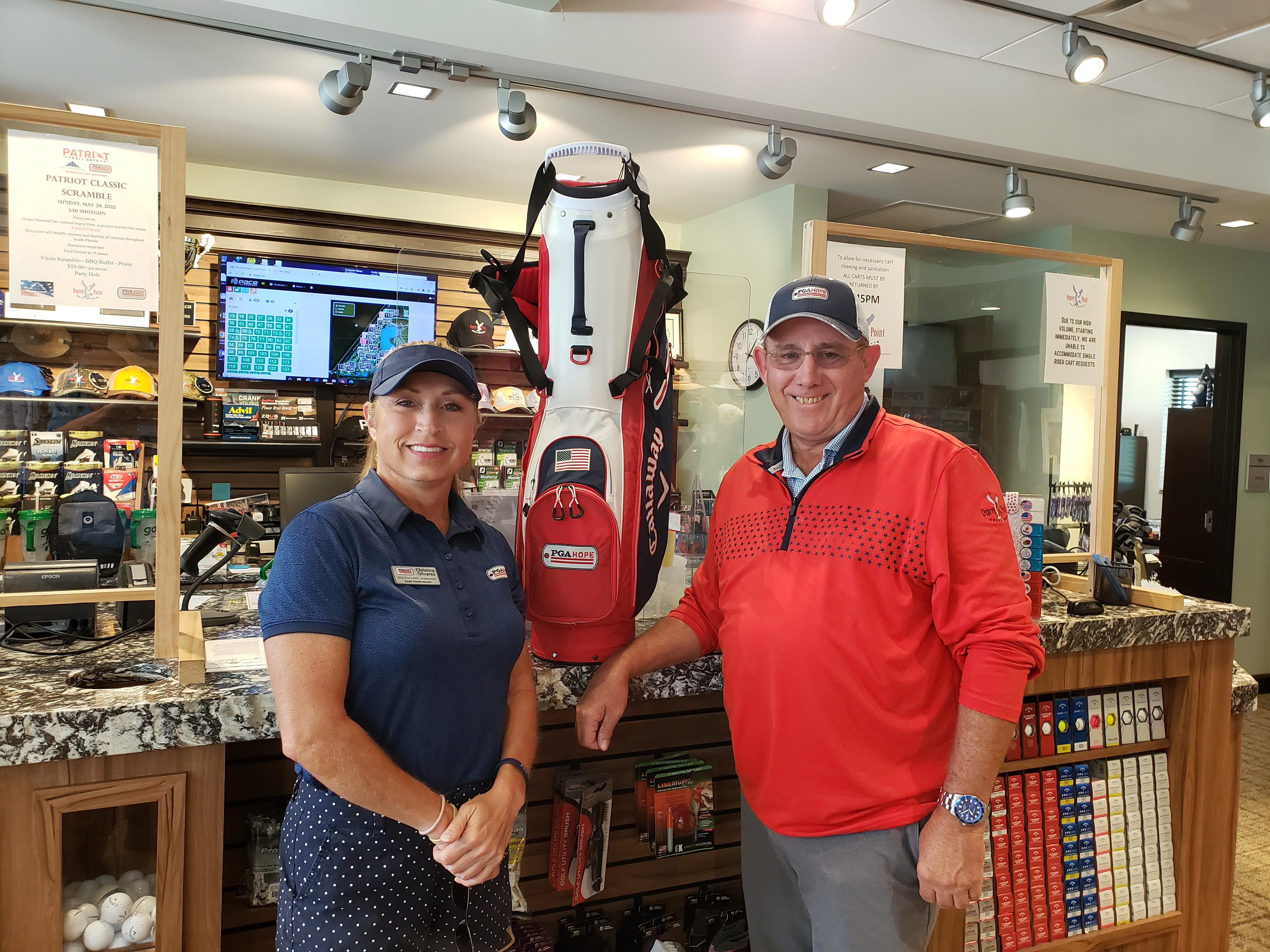 Christina Olivarez poses with Bo Preston, the general manager of Osprey Point Golf Club in Boca Raton.  Preston was named the 2021 Patriot Award recipient for the South Florida Section.