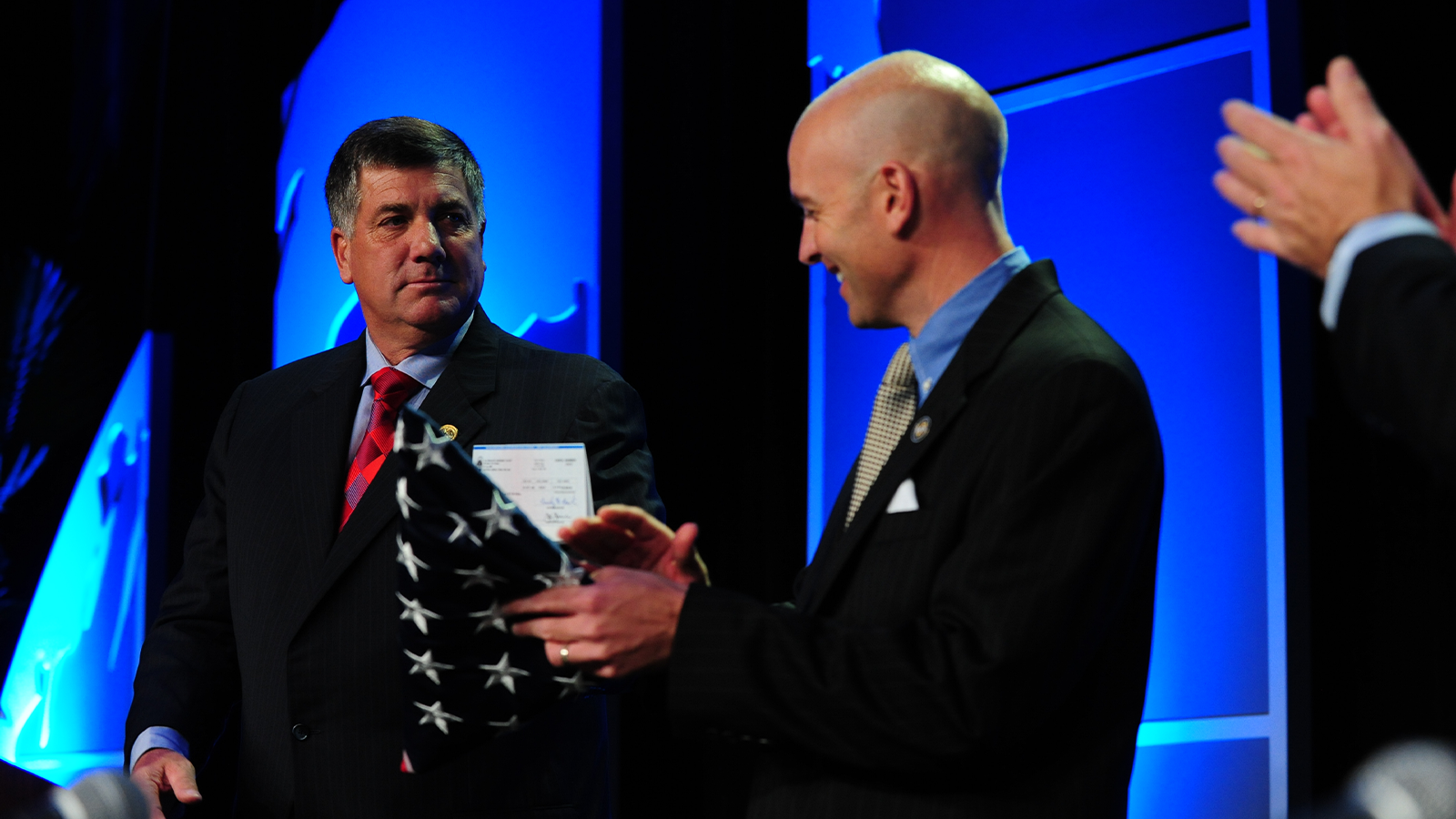 35th PGA President Brian Whitcomb presents a donation check to Dan Rooney of the Folds of Honor Foundation during the 92nd PGA of America Annual Meeting at JW Marriott Desert Ridge Resort & Spa in Phoenix, Arizona, USA, on Saturday, November 8, 2008. (Photo by Montana Pritchard/The PGA of America)