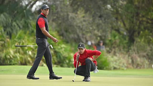 Tiger Woods and his son, Charlie Woods, read the third green during the final round of the PNC Championship at The Ritz-Carlton Golf Club on December 18, 2022 in Orlando, Florida. (Photo by Ben Jared/PGA TOUR via Getty Images)