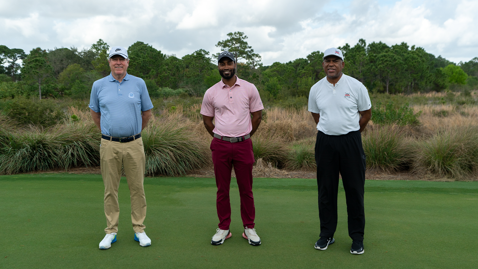 PGA of America President John Lindert, Clay Myers II, PGA, and Cole Smith smile on the first tee of the Dye Course at the APGA TOUR Black History Month Classic held at the PGA Golf Club on February 19, 2021 in Port St. Lucie, Florida. (Photo by Rachel Harris/PGA of America)