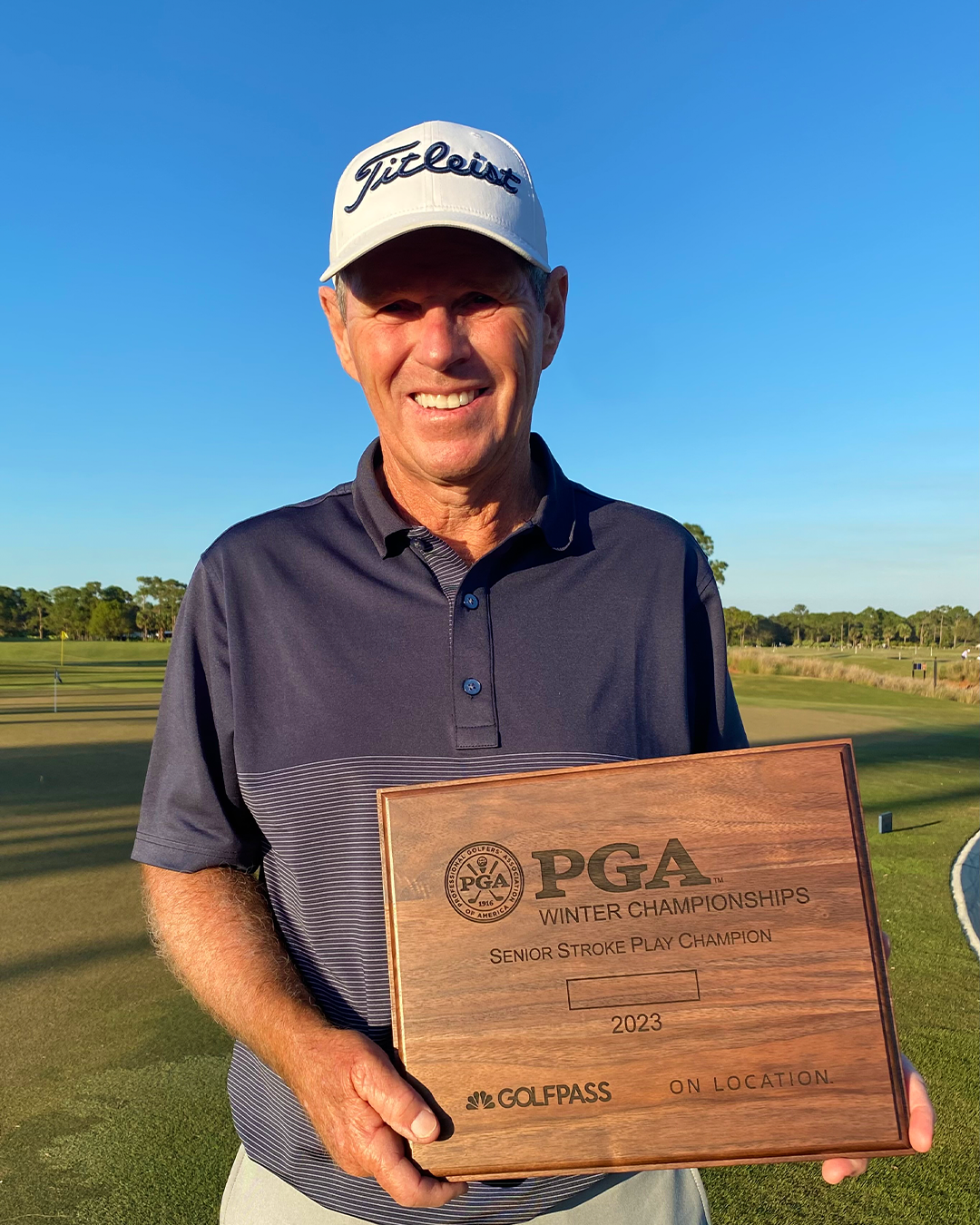 Gary Robison holds the 2023 PGA Senior Stroke Play Championship trophy after his impressive victory at PGA Golf Club. 