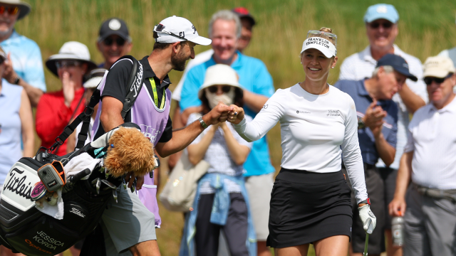 Jessica Korda of the United States celebrates with her caddie after holing out from a chip shot on the 11th hole during the second round of the KPMG Women's PGA Championship at Congressional Country Club on June 24, 2022 in Bethesda, Maryland. (Photo by Rob Carr/Getty Images)
