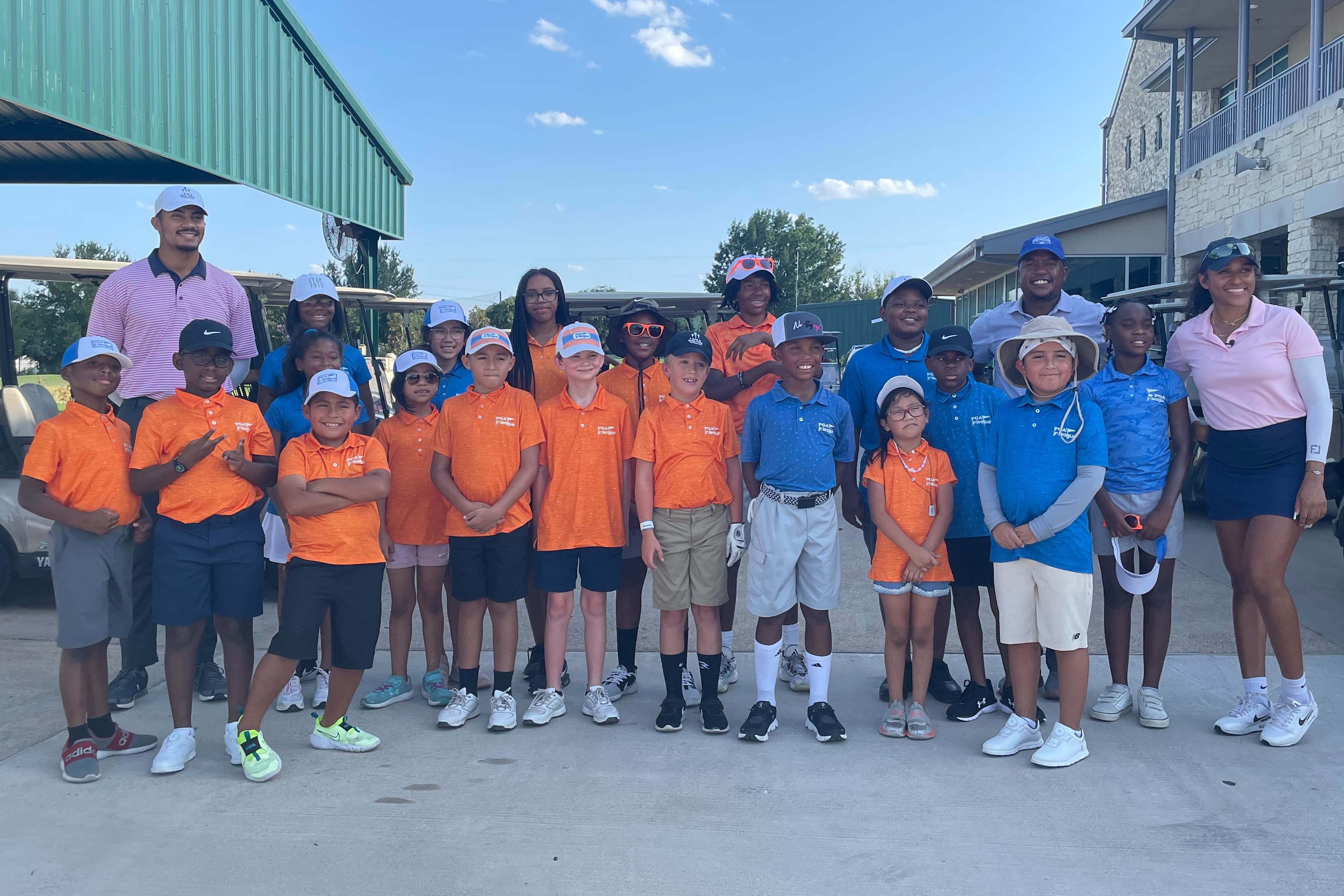 Molayo (back right) puts an emphasis on providing access to golf at Cedar Crest.