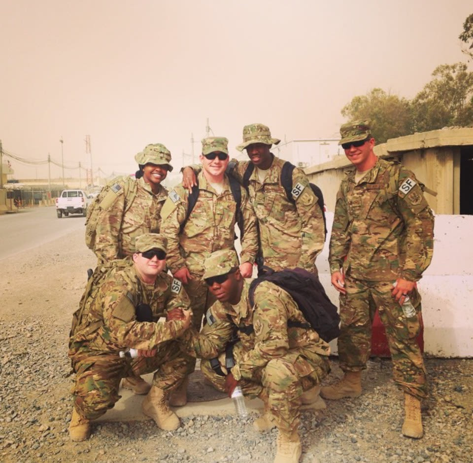 Jordan Johnson (bottom left) during a tour in Afghanistan.
