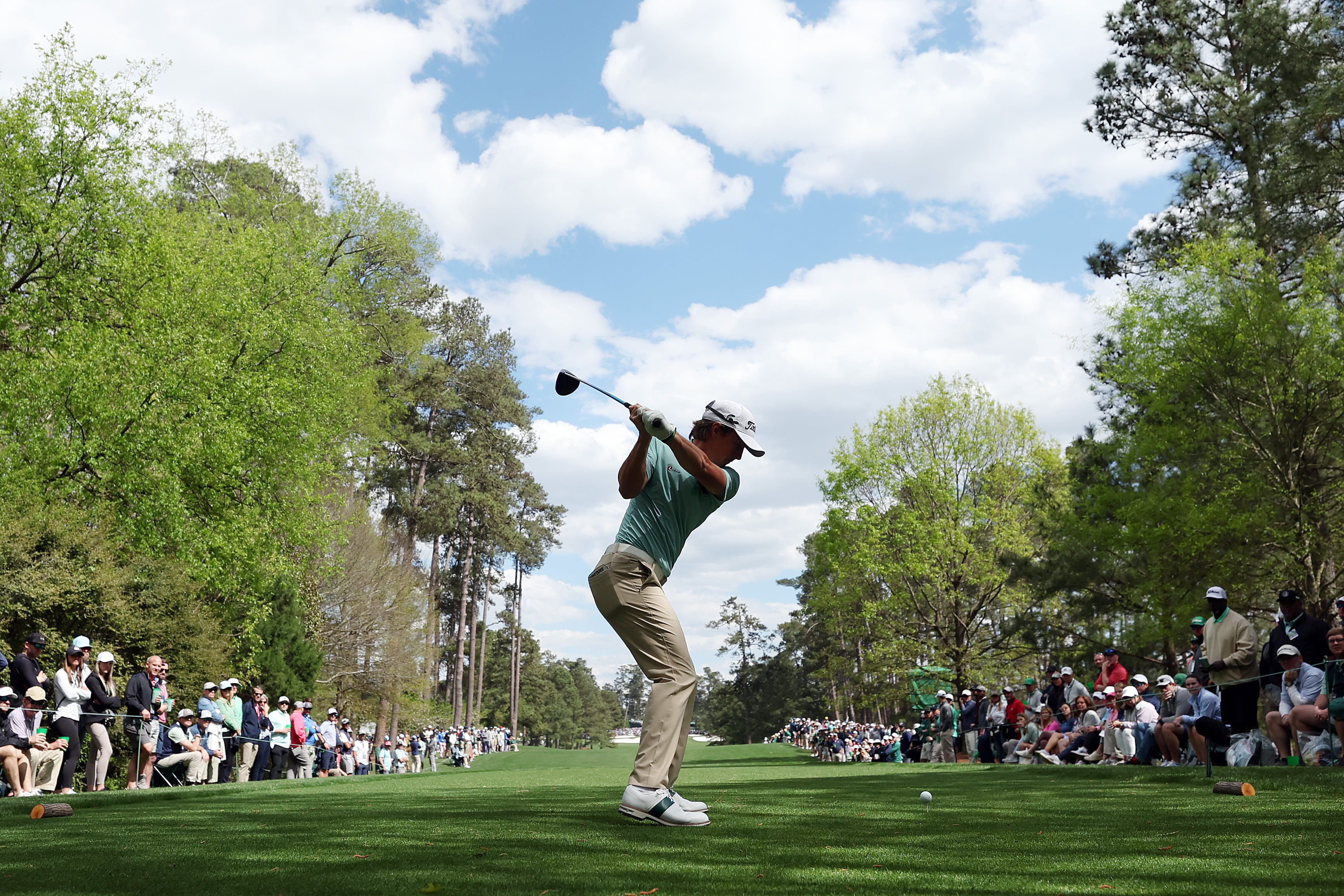 Brian Cairns' player James Piot hits a tee shot at Augusta National